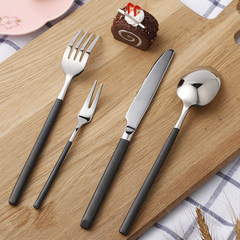 Two sets of cutlery, three sets of black knives, steak knives and forks and spoons Dessert spoon with black handle