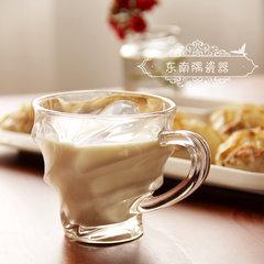 Small glass with hand, small milk, breakfast cup, creative transparent yogurt pudding glass